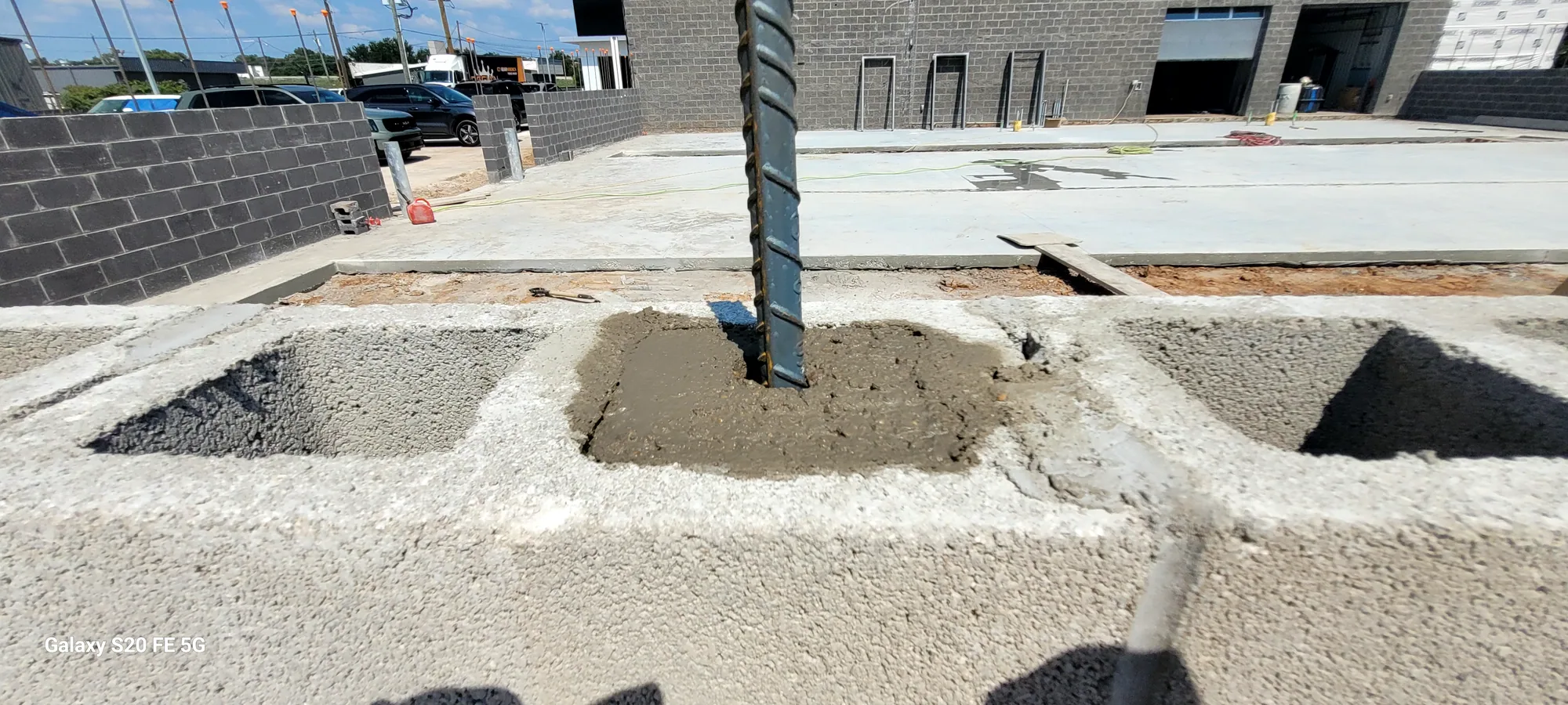 Steel rebar set into fresh concrete on a North Texas concrete project